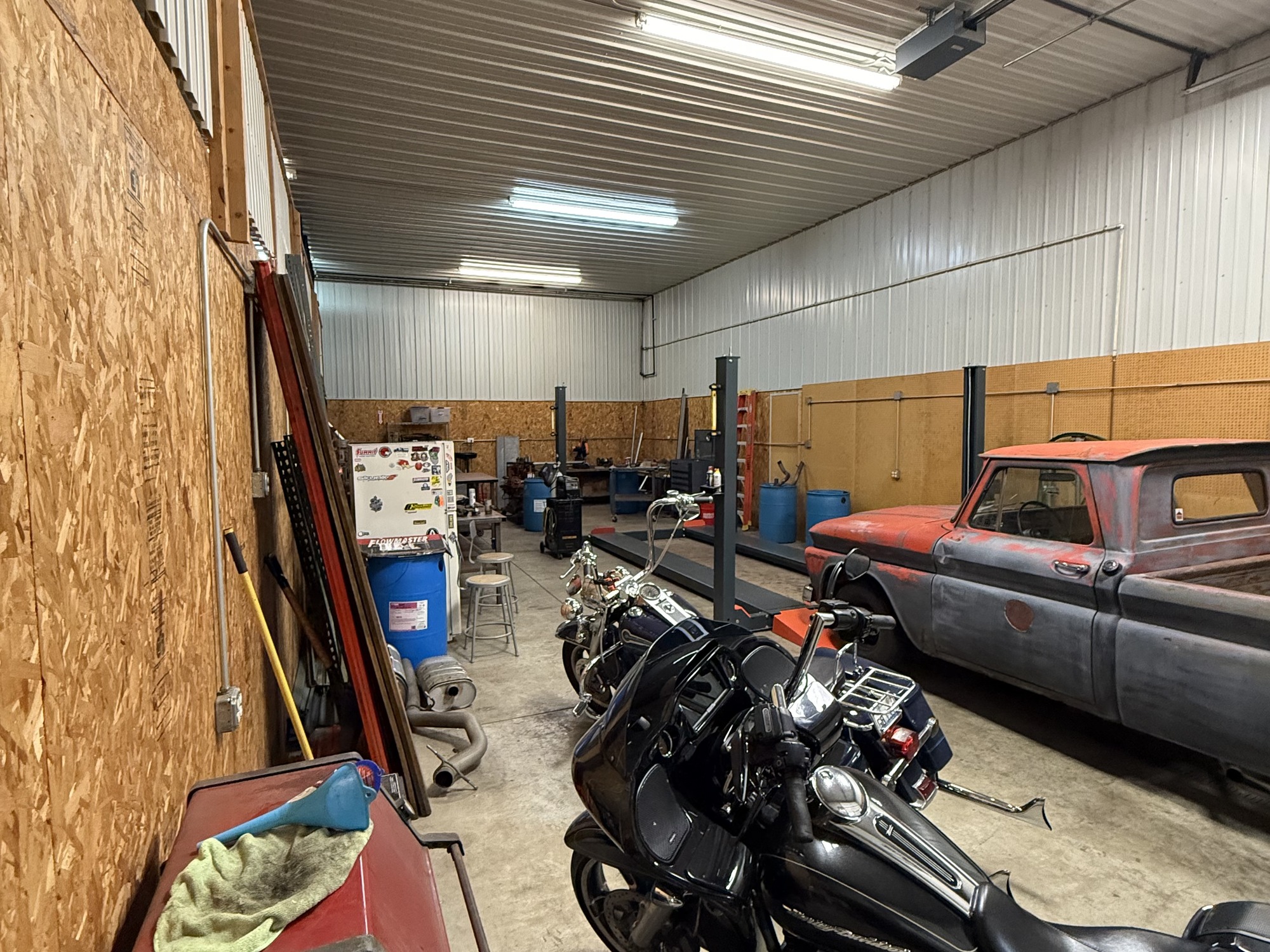 Unit 2 heated warehouse with vehicle lifts and storage