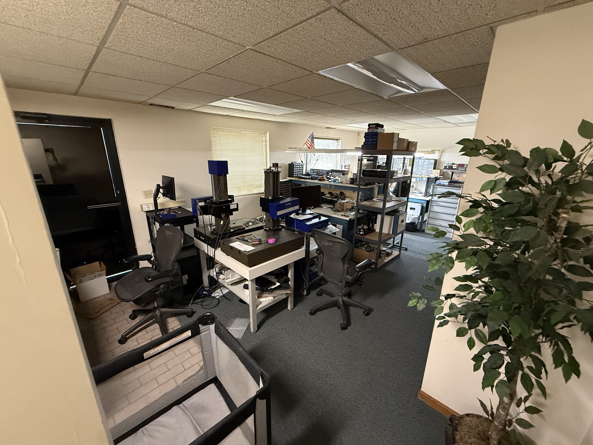Office workspace with equipment and shelving